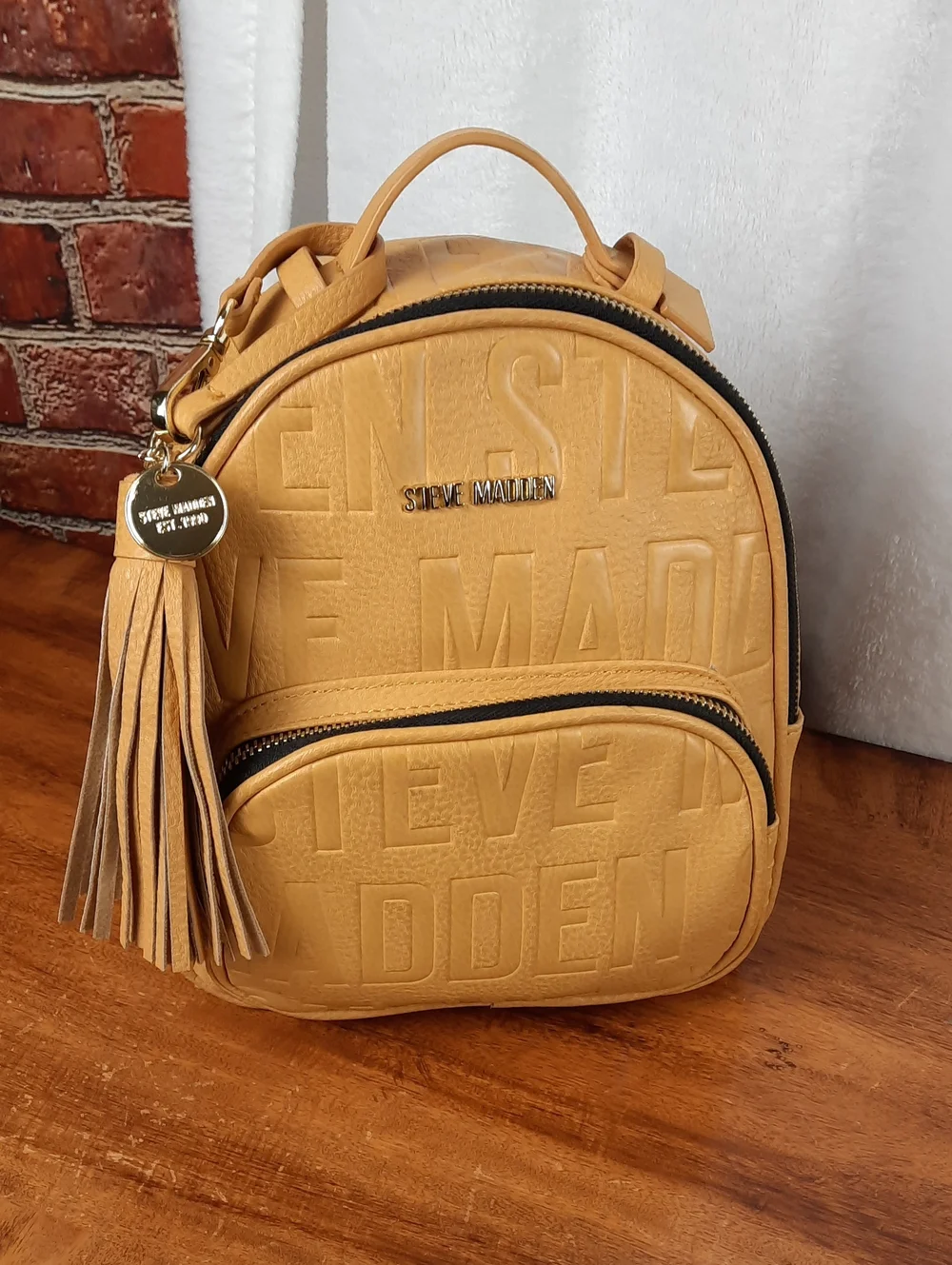 Steve Madden Mustard Mini Tassel Backpack